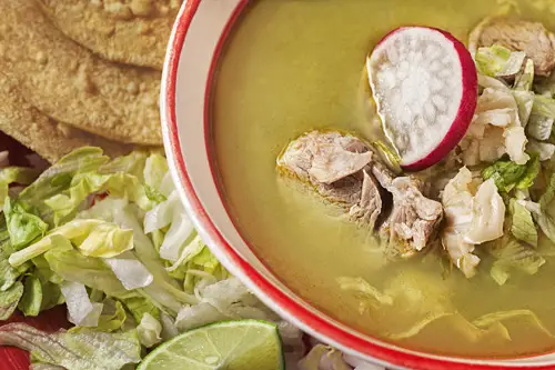 Green Pozole with Pork accompanied with more ingredients